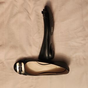 Black Nine West flats with gold buckle